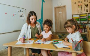 montessori teacher working with kids