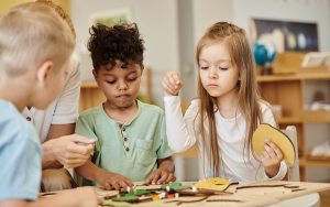 kids playing together at montessori school