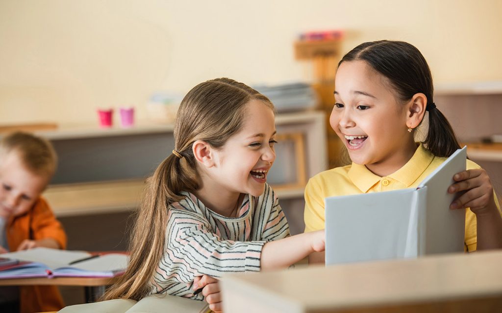 kids smiling at montessori school