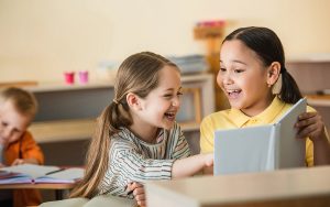 kids smiling at montessori school