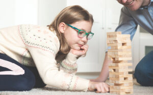 girls playing with wooden blocks