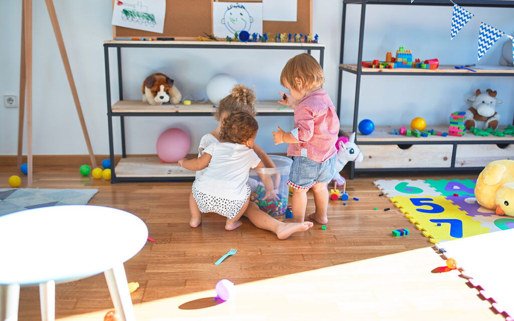 little kids playing together in a class