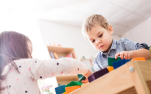 kids playing together in a classroom