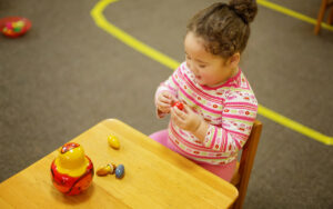 little girl playing in the classroom