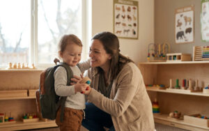 happy mom in kids' classroom