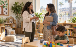 Parent touring a preschool classroom in Chula Vista while speaking with a teacher.